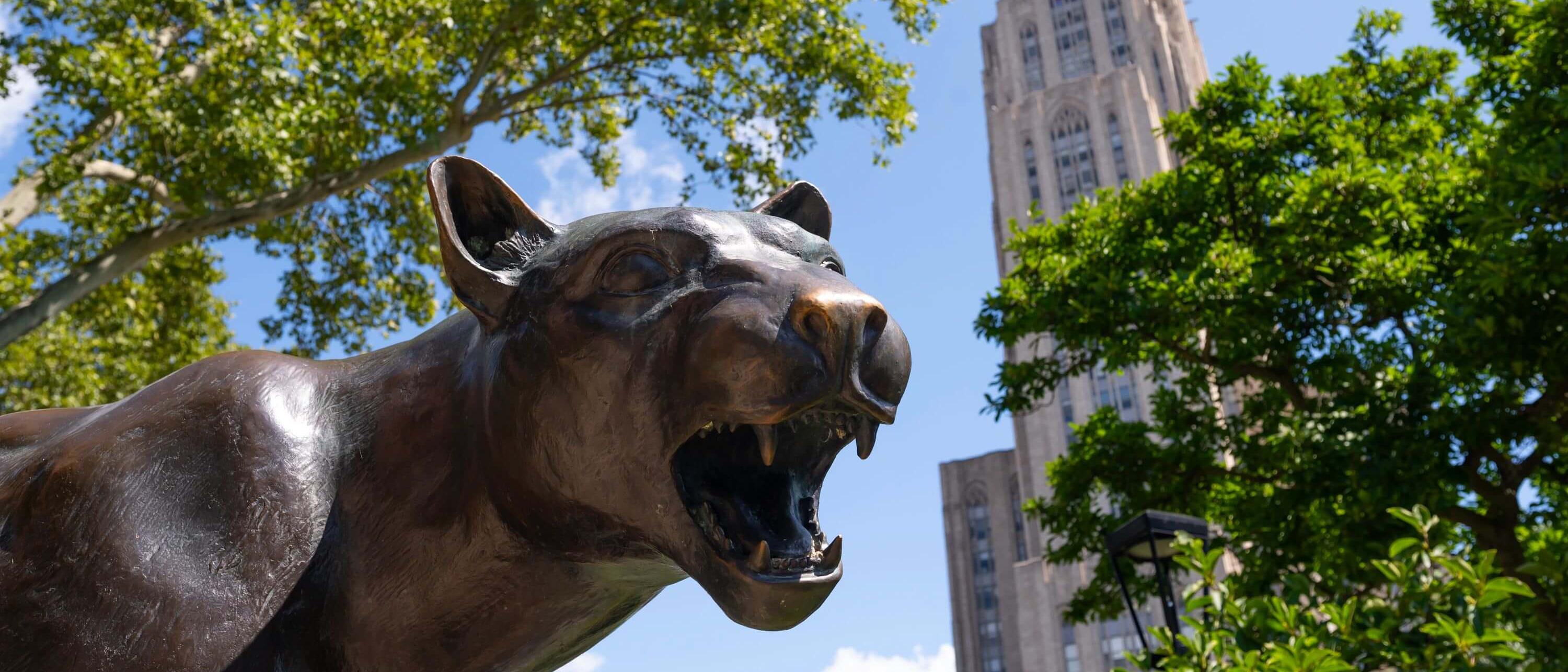 Roc the panther statue with the cathedral in the background